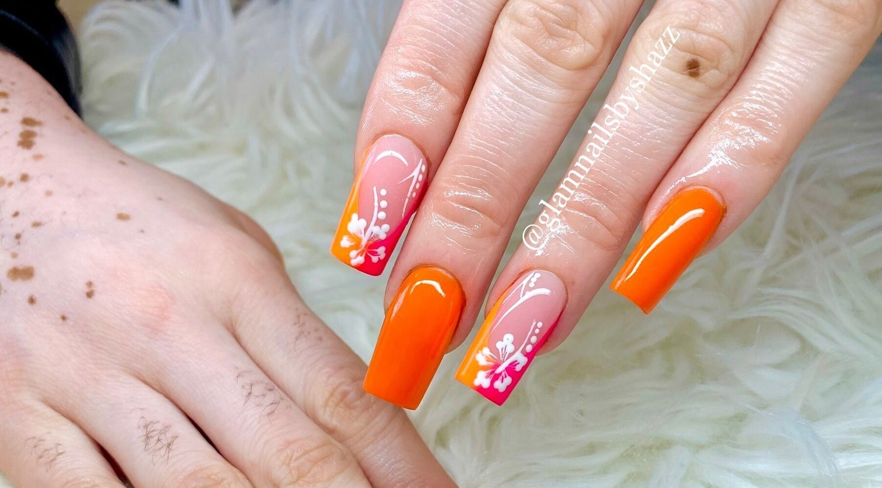 Vibrant manicured nails with floral art at Glam Nails by Sharon Melamu, Kuruman, Northern Cape, ZA.