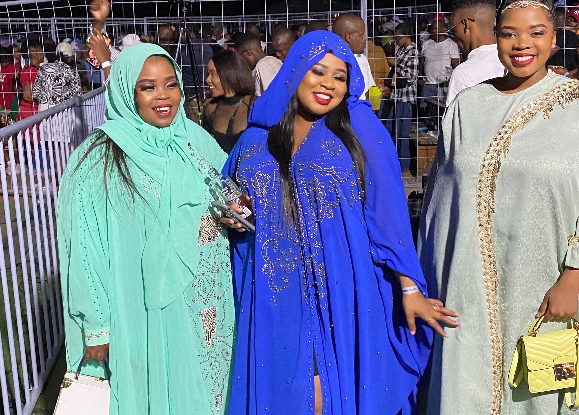 Three women in colorful attire at Glam Nails by Sharon Melamu event, Kuruman, Northern Cape, ZA.