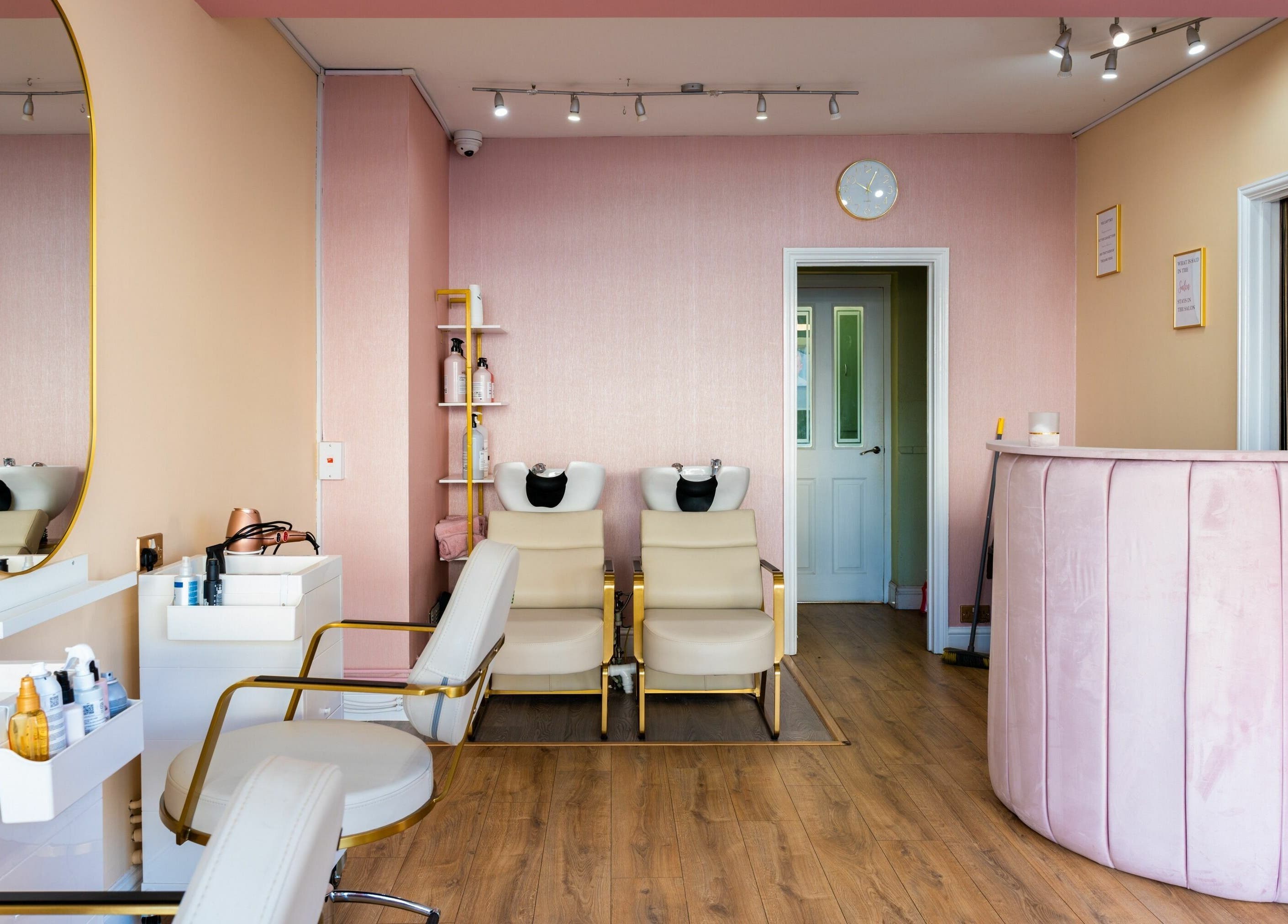 Modern salon interior at Head Start in Swanscombe, England, GB with stylish decor and plush seating.