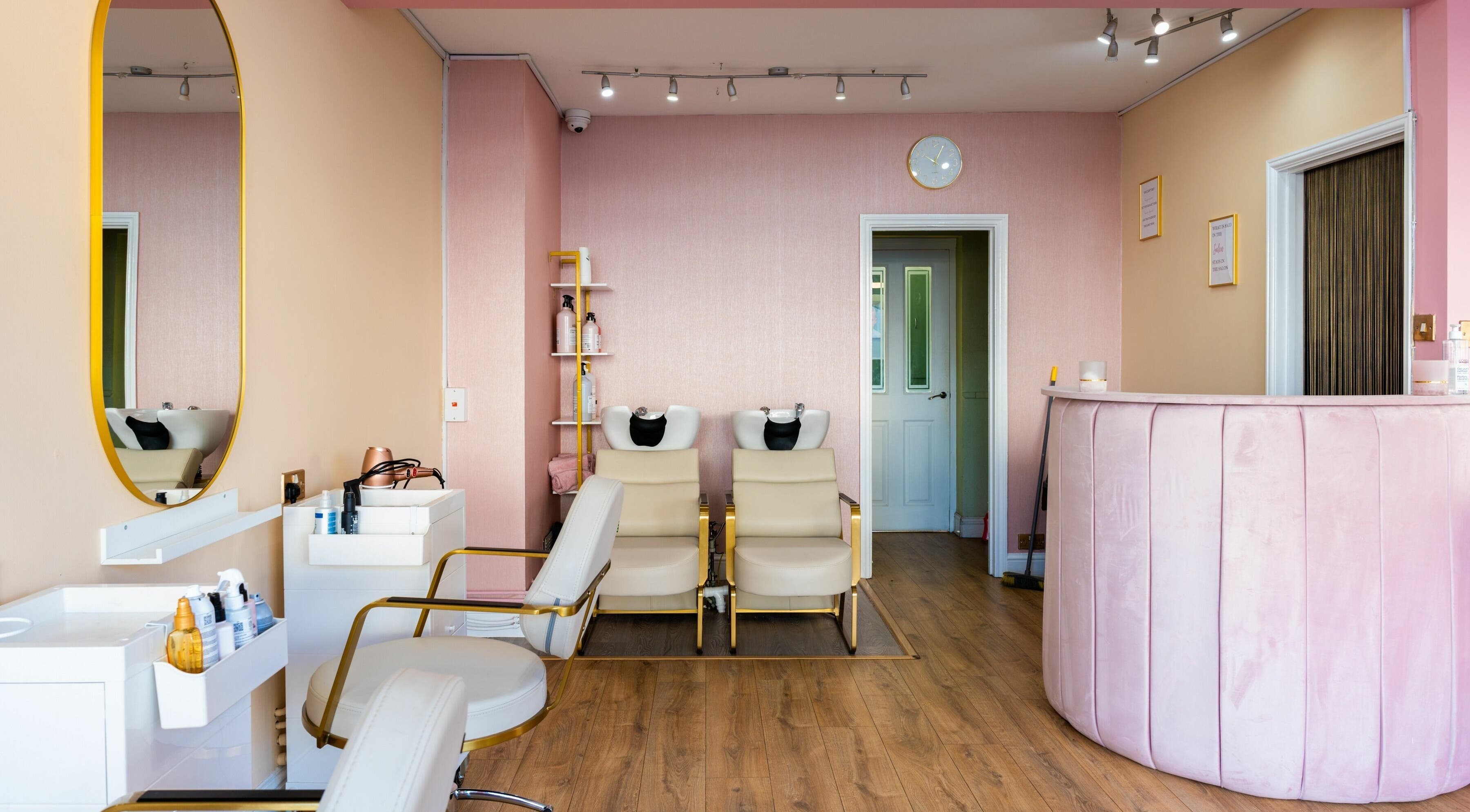 Modern salon interior at Head Start in Swanscombe, England, GB with stylish decor and plush seating.
