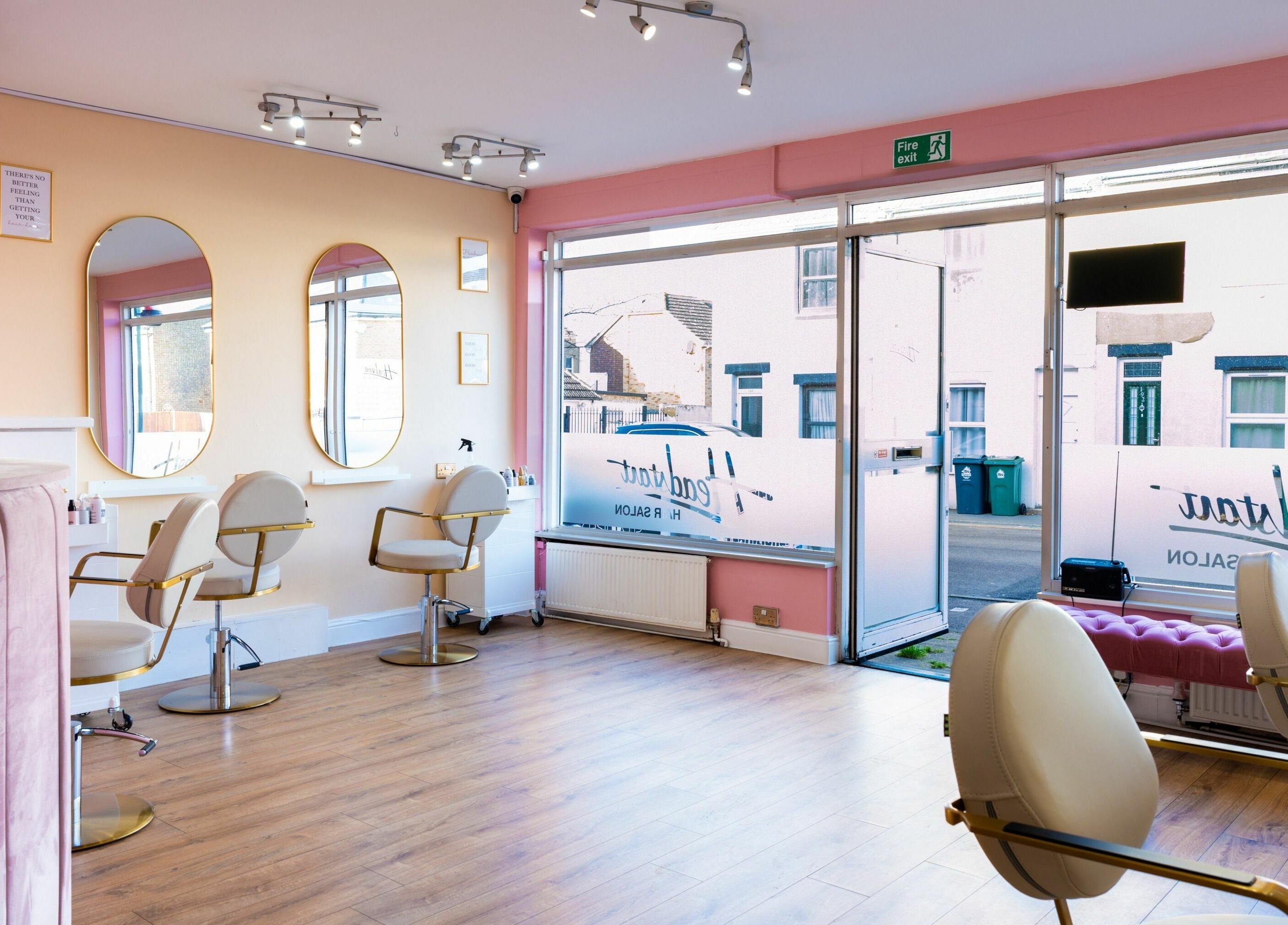 Modern salon setup at Head Start in Swanscombe, England, GB featuring elegant mirrors and stylish chairs.