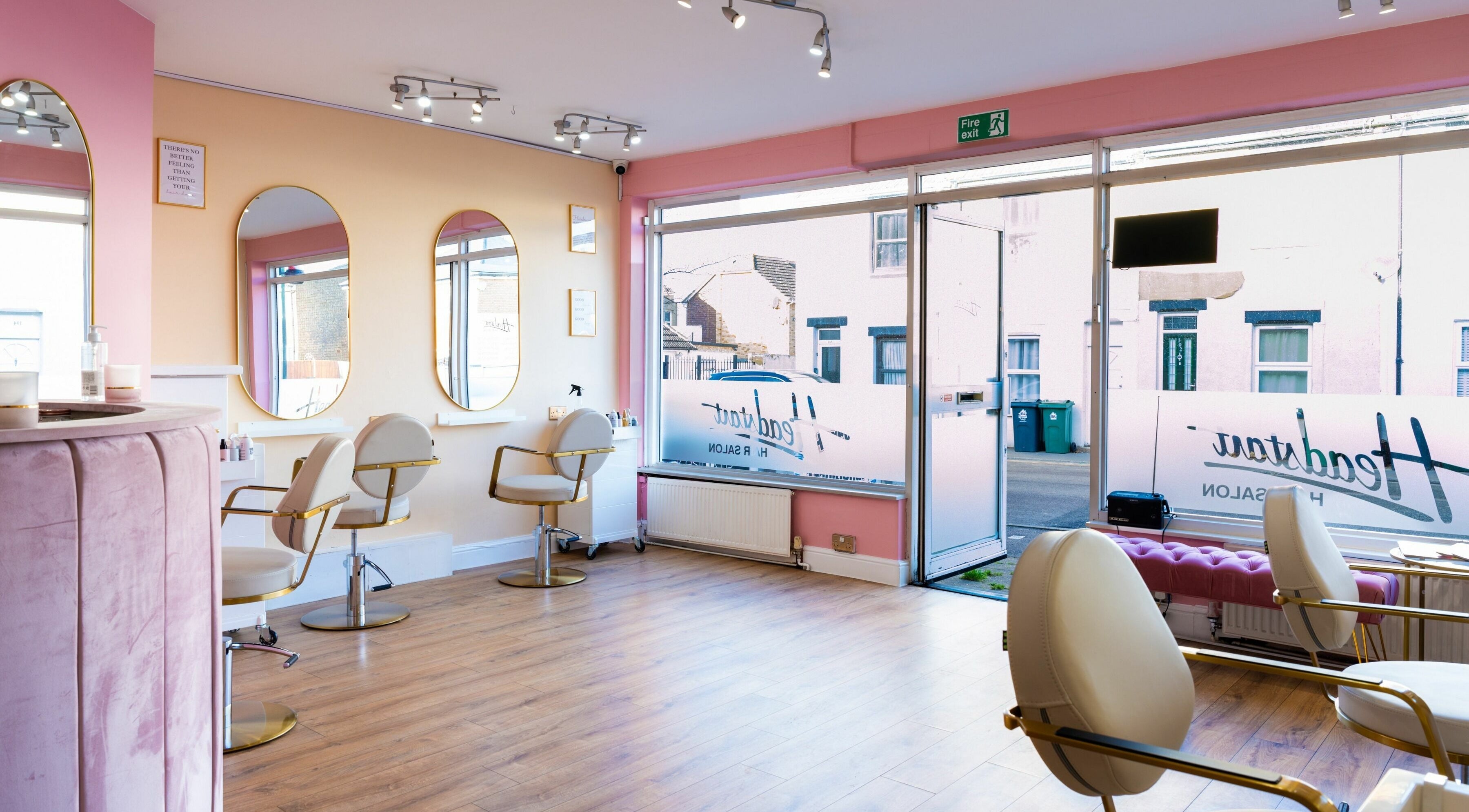 Modern salon setup at Head Start in Swanscombe, England, GB featuring elegant mirrors and stylish chairs.