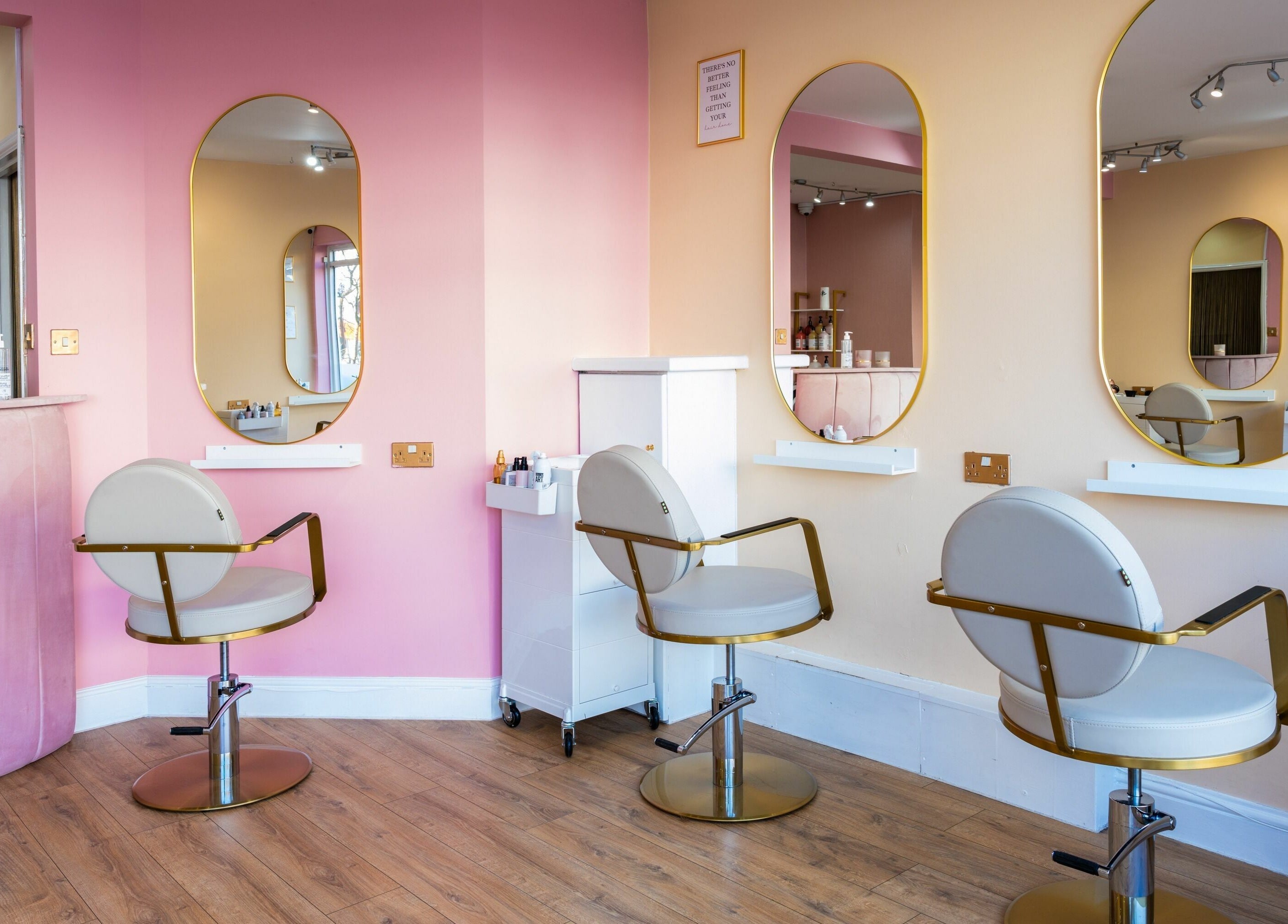Modern salon interior at Head Start, Swanscombe, England, GB, featuring stylish seating and mirrors.