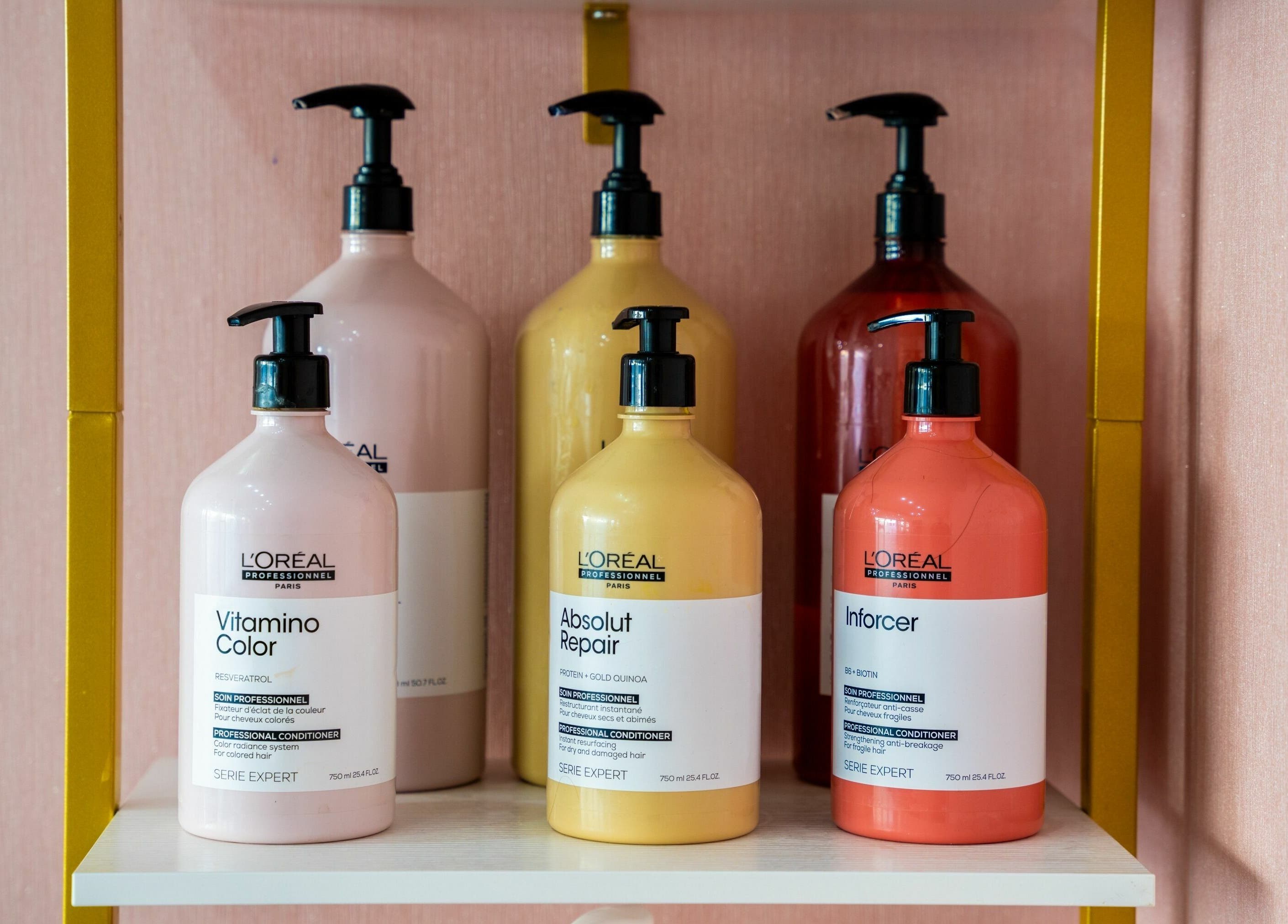 Professional hair care products at Head Start, Swanscombe, England, GB, displayed on a stylish shelf.