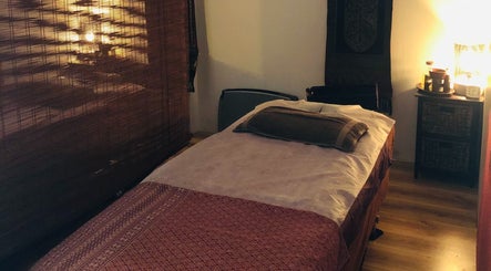 Cozy massage room at Chantara Massage, Palmerston North, Manawatu-Wanganui, NZ with dim lighting and relaxing decor.