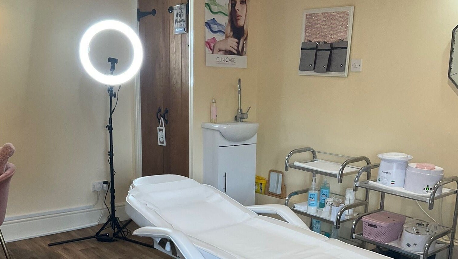 Cozy treatment room at La Bonne Vie, Cawood, England, GB with a comfortable bed and beauty equipment.