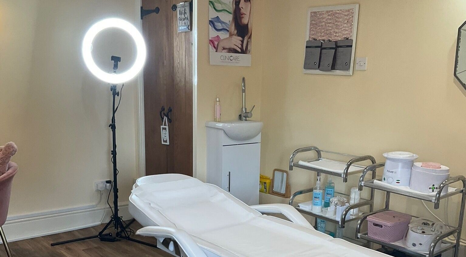 Cozy treatment room at La Bonne Vie, Cawood, England, GB with a comfortable bed and beauty equipment.