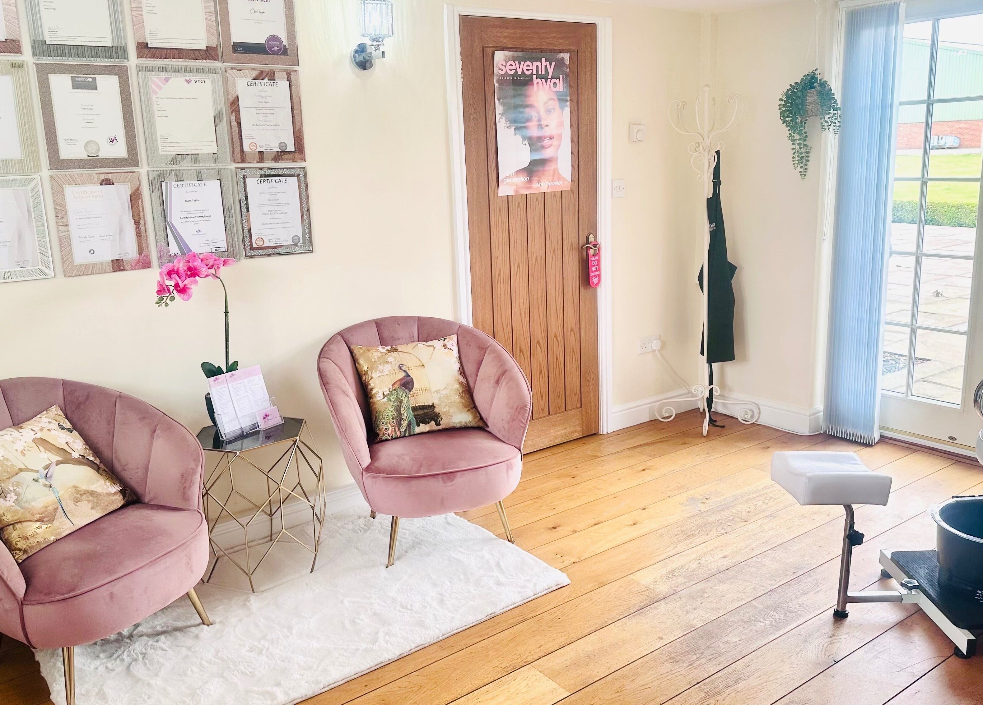 Elegant seating area at La Bonne Vie, Cawood, England, GB, featuring plush chairs and certificates.
