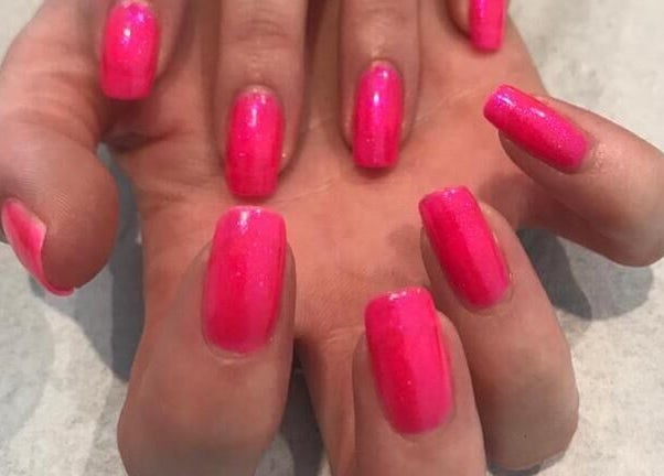 Bright pink nails at Debeaut by Della, Havant, England, GB, showcasing expert manicure services.