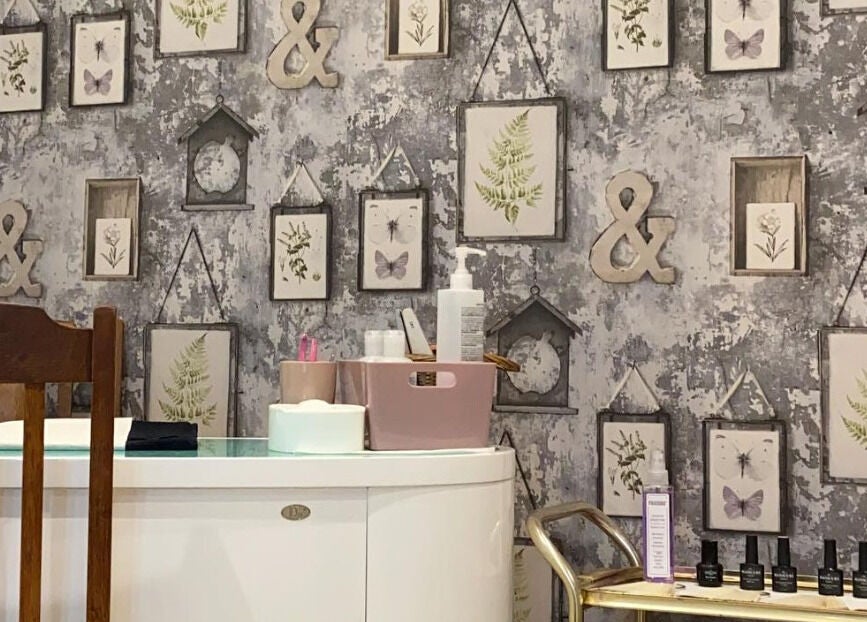 Stylish wall decor and nail care setup at Debeaut by Della, Havant, England, GB.