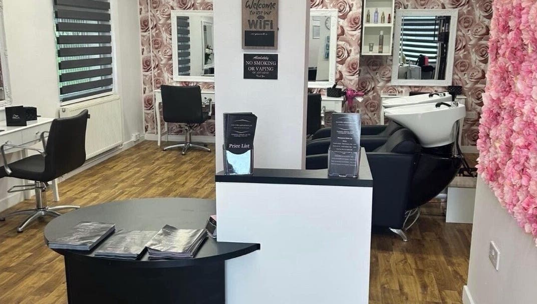 Interior view of K&E Pro Aesthetics Ltd in Bar Hill, England, showcasing stylish decor and professional beauty stations.