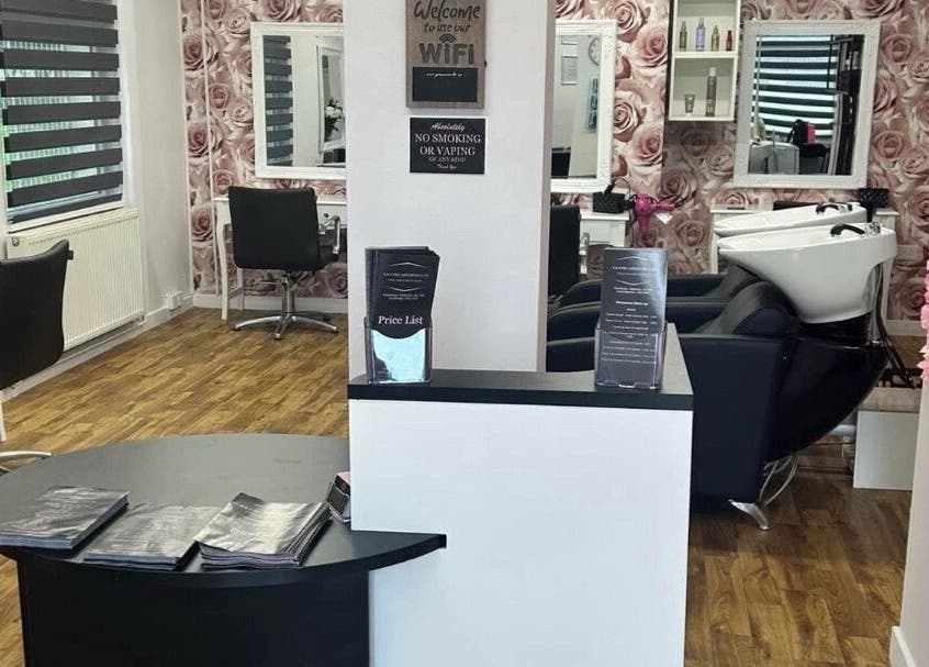 Interior view of K&E Pro Aesthetics Ltd in Bar Hill, England, showcasing stylish decor and professional beauty stations.