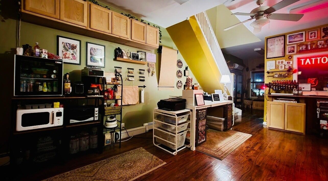 Warm interior of Obscura - Art, Tattoo + Body Mod. Studio in Long Beach, New York, US showcasing eclectic design.