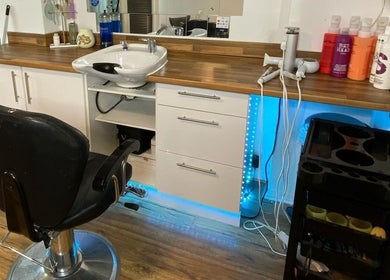 Modern hairdressing station at Amy Rawlings Hairdressing in Worthing, England, GB with sleek design and tools.