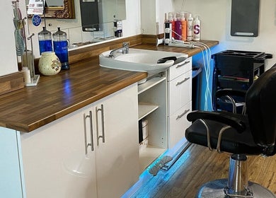 Chic salon station at Amy Rawlings Hairdressing in Worthing, England, GB. Features a modern chair and stylish counter.