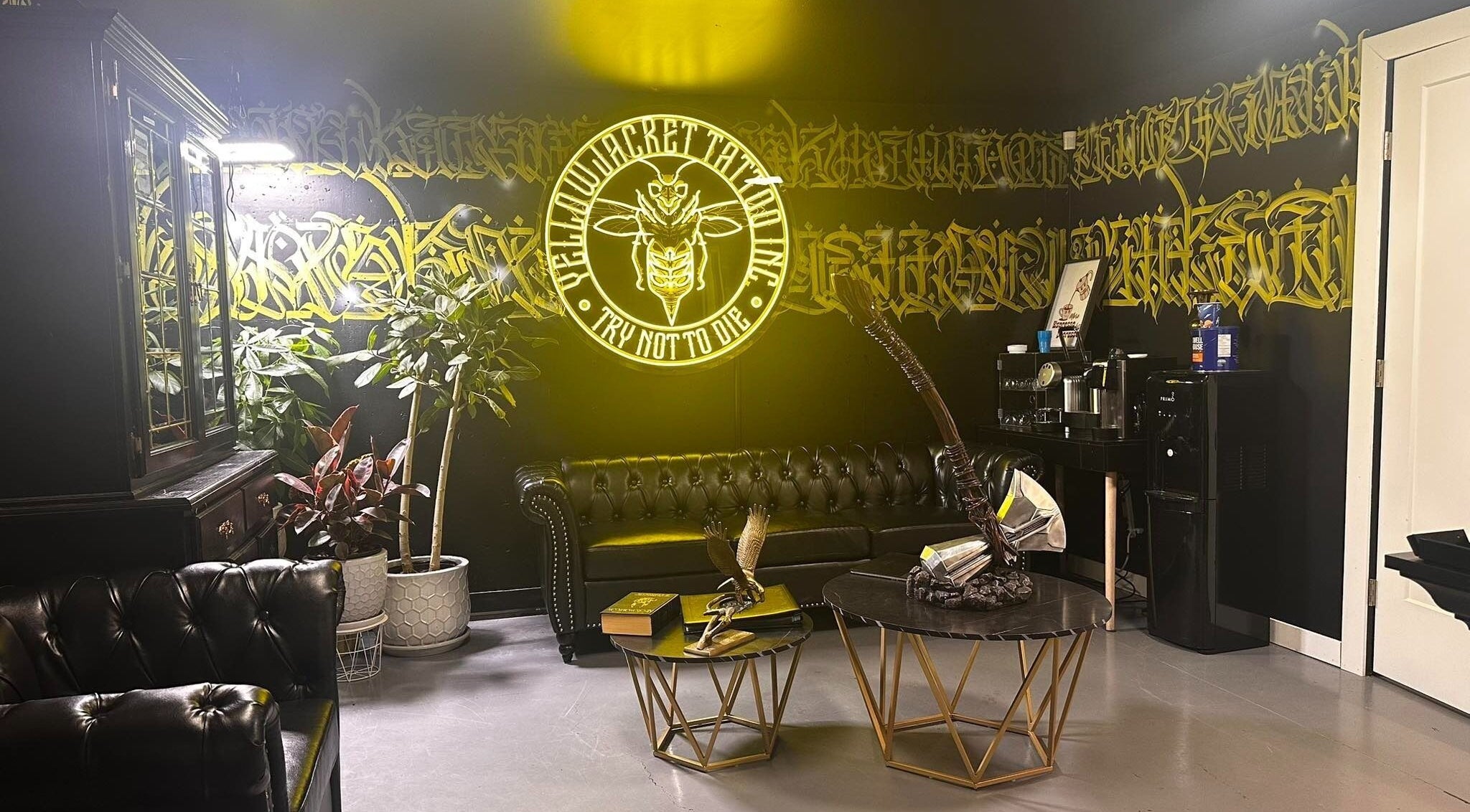 Stylish interior of Yellowjacket Tattoo in Saskatoon, Saskatchewan, CA featuring elegant seating and unique decor.