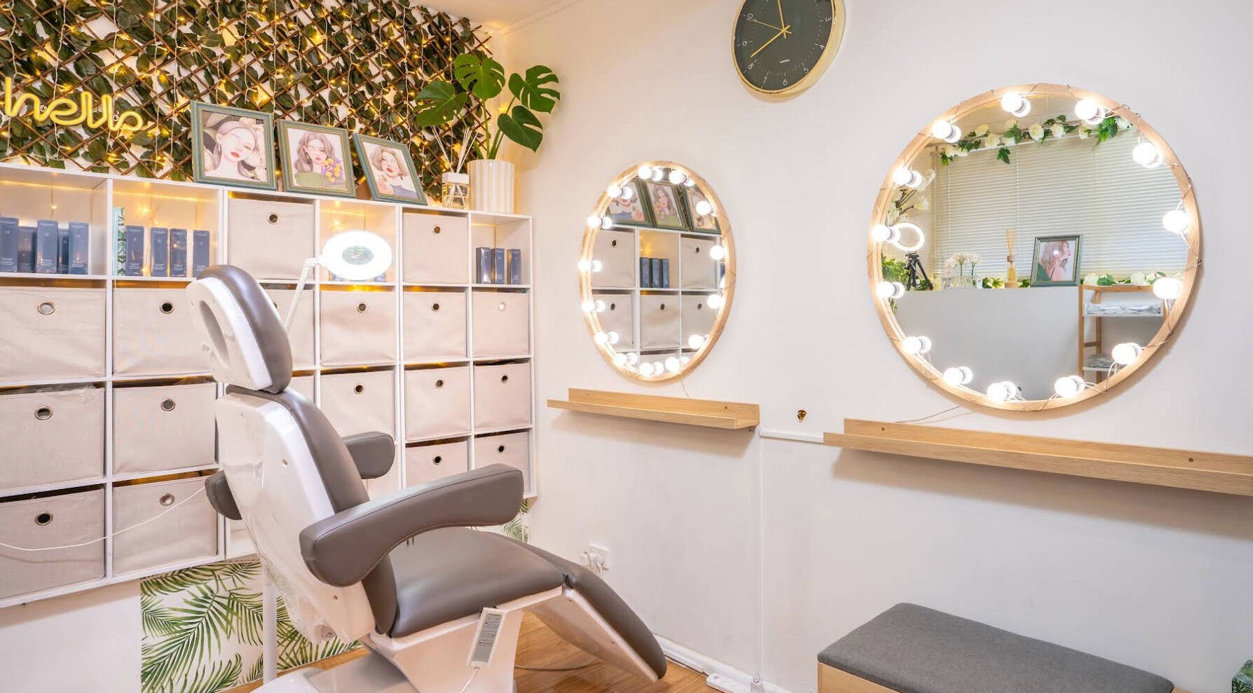 Elegant salon interior at Sienna Beauty Bar in Melbourne, Victoria, AU with stylish decor and lit mirrors.