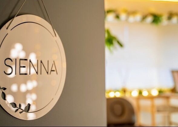 Elegant sign of [SE:RE] Sienna Beauty Bar in Melbourne, Victoria, AU, with soft lighting.