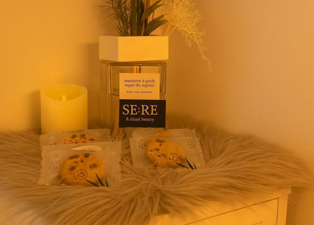 Cozy nook at Sienna Beauty Bar in Melbourne, Victoria, AU with calming candle and decor.