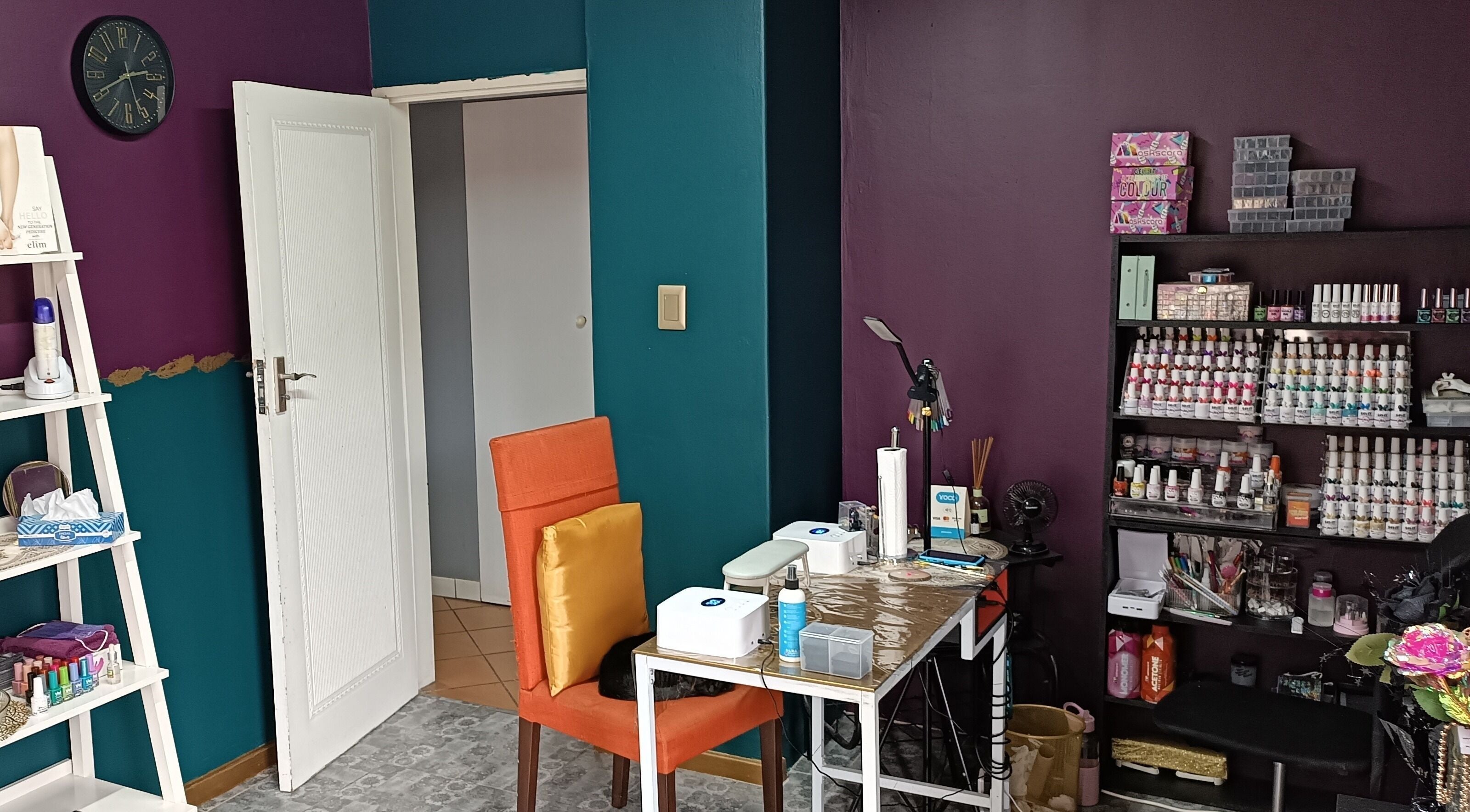 Chic nail art station at D-vinely Unique Artistry in Pretoria, Gauteng, ZA with colorful decor.