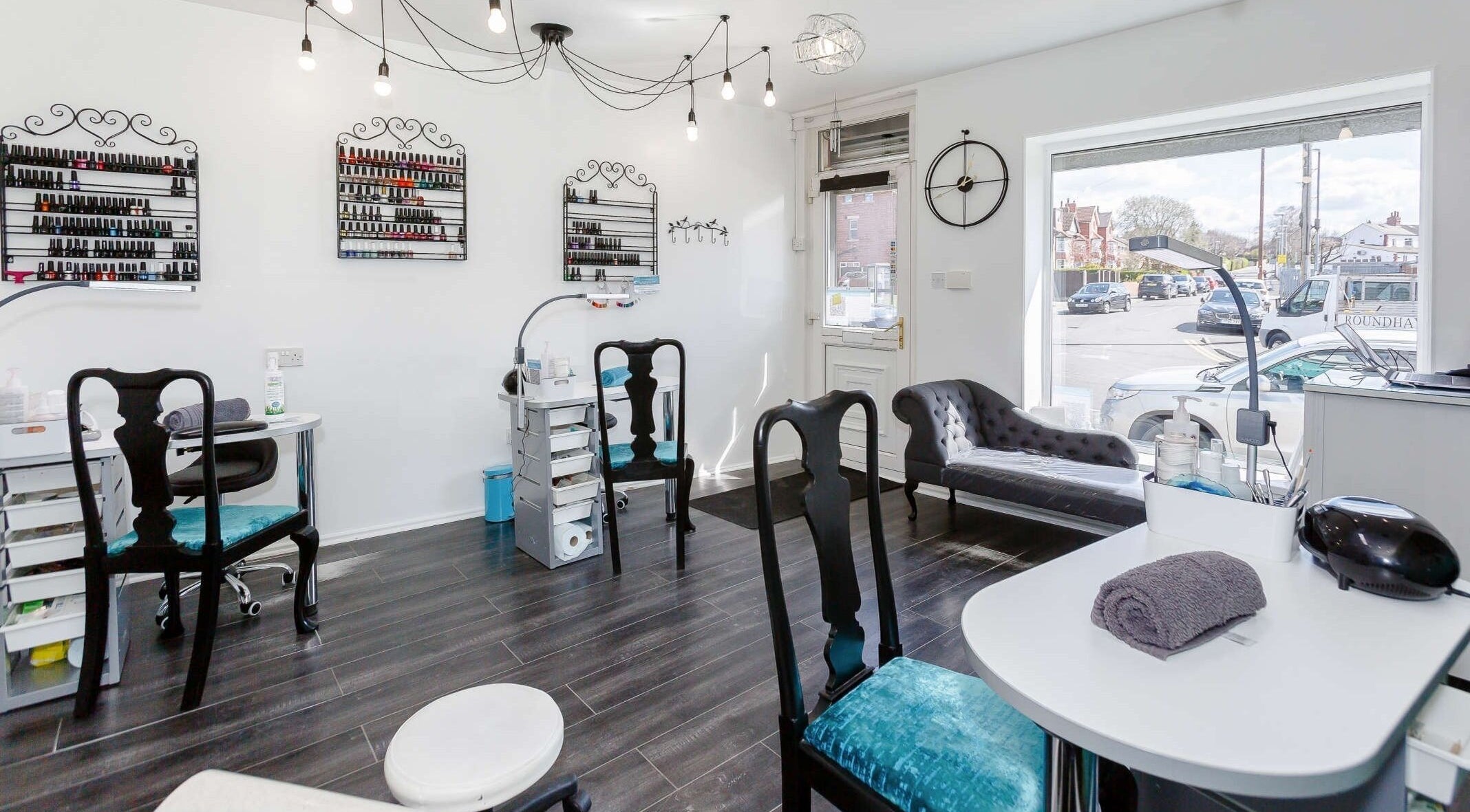 Amour Professional Beauty salon interior in Leeds, England, GB, showcasing nail care stations and chic decor.