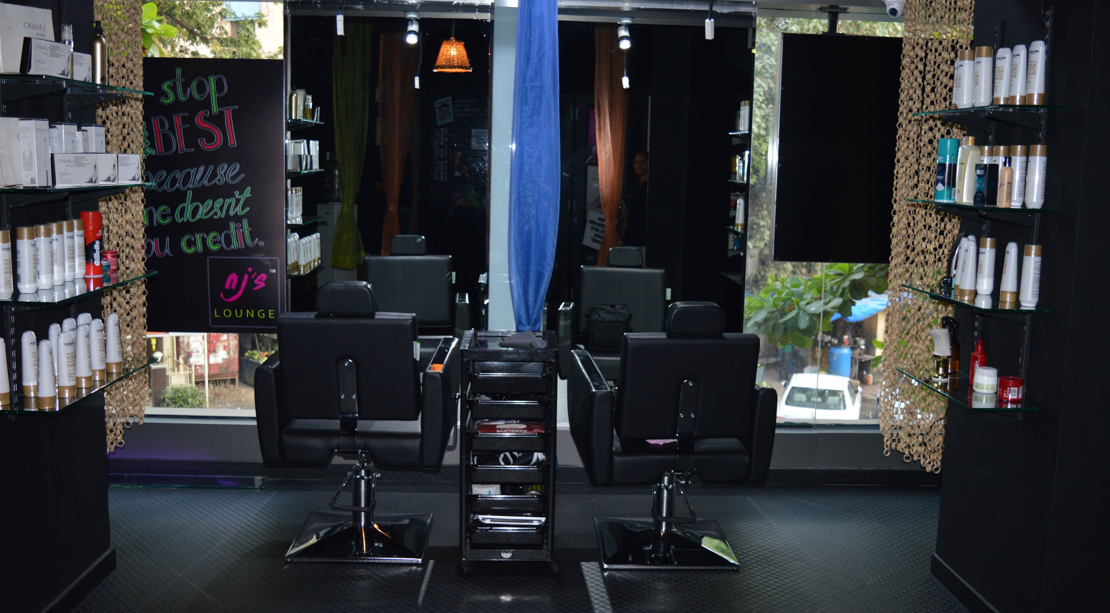 Interior of Nj's Lounge Talaopali Branch - Thane featuring stylish salon chairs. Located in Thane, Maharashtra, IN.