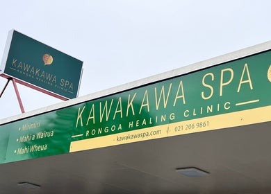Te Whare O Kawakawa Spa signage in Fairfield, Hamilton, NZ showcasing wellness services.