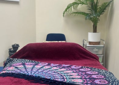 Relaxing therapy room at Te Whare O Kawakawa Spa, Fairfield, Hamilton, NZ with lush decor.