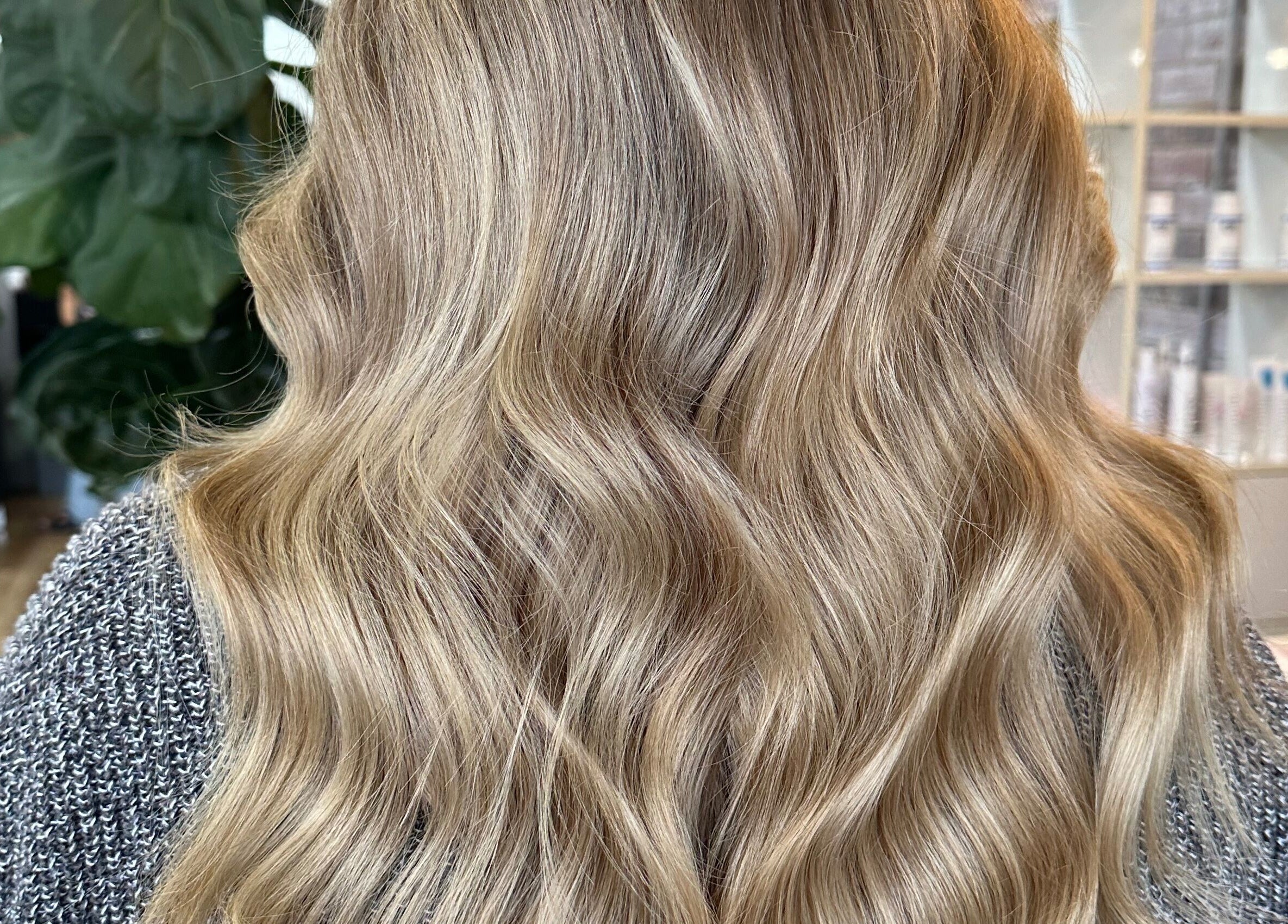 Elegant wavy blonde hair styled at Two Blondes salon, Melbourne, Victoria, AU for a chic makeover.