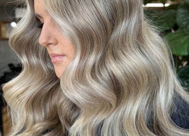Elegant wavy blonde hairstyle at Two Blondes in Melbourne, Victoria, AU.