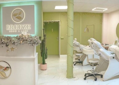 Interior of Breeze Brow and Lash, Glasgow, Scotland, GB, featuring modern design and comfortable beauty chairs.