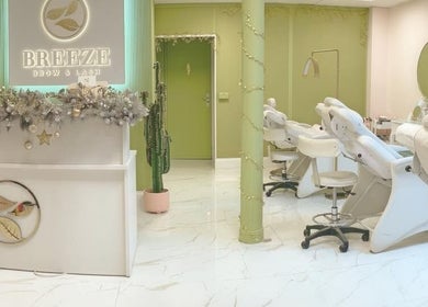 Elegant interior of Breeze Brow and Lash, Glasgow, Scotland, GB, featuring chic furnishings and decor.