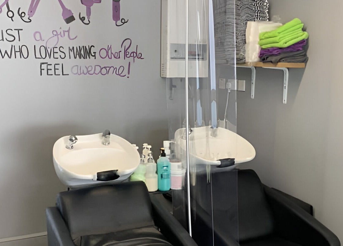 Headlines salon in Ramsey, England, GB features modern wash stations and cozy seating in a vibrant atmosphere.