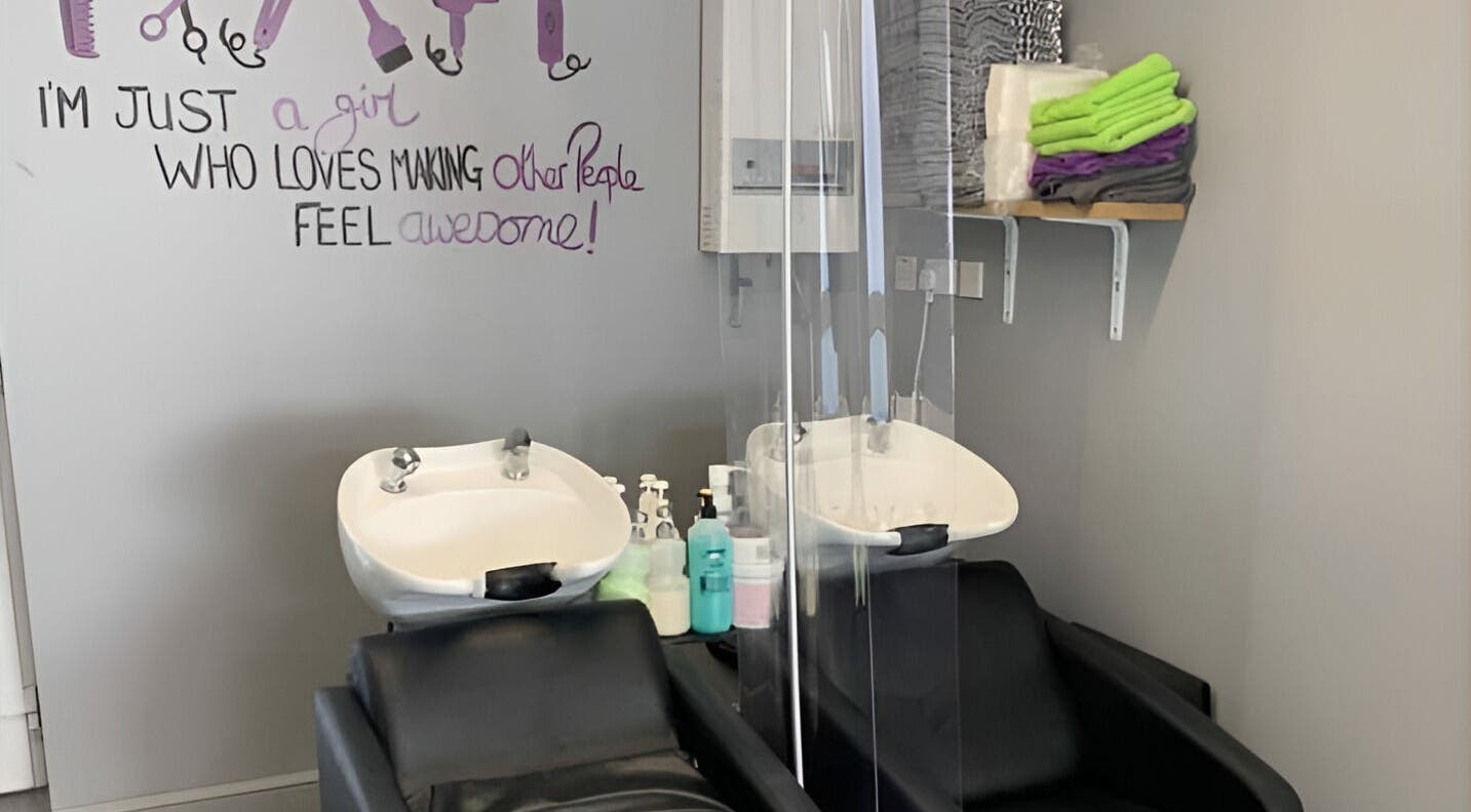 Headlines salon in Ramsey, England, GB features modern wash stations and cozy seating in a vibrant atmosphere.