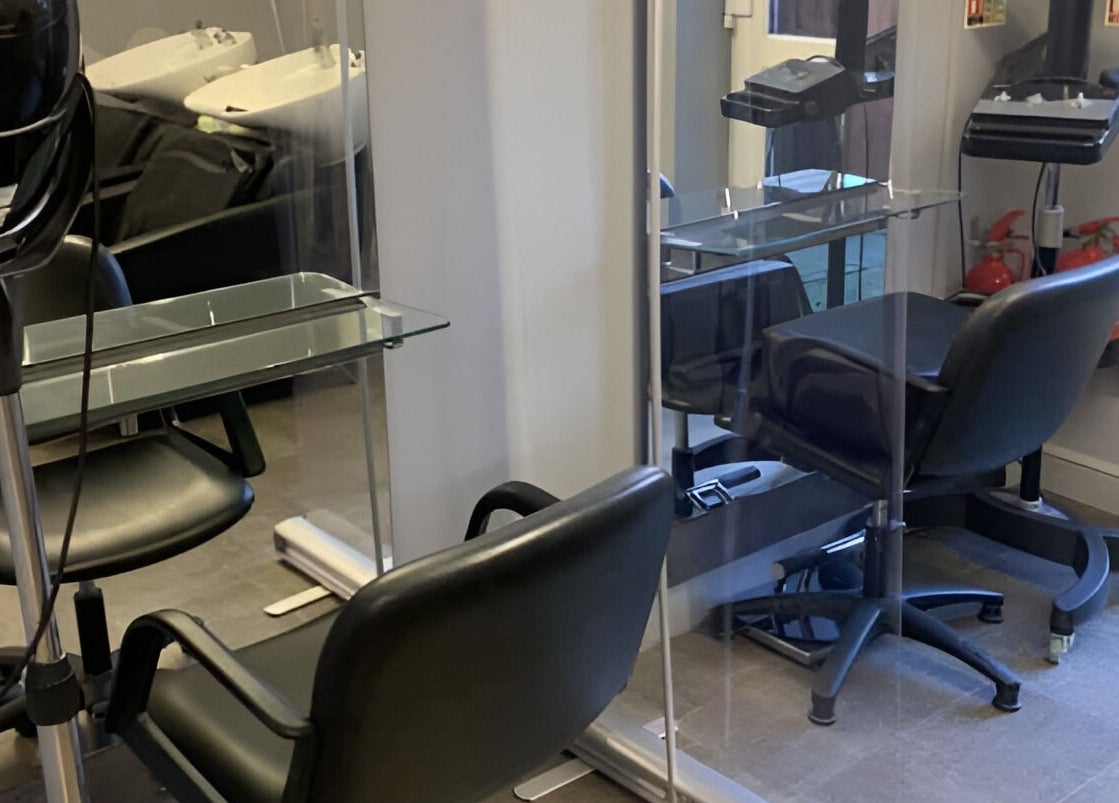 Luxurious salon chairs and styling stations at Headlines, Ramsey, England, GB, offering premium beauty services.