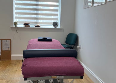 Tranquil therapy room at JH Sport Manual Therapy, Norwich, England, GB. Features a comfortable massage table.