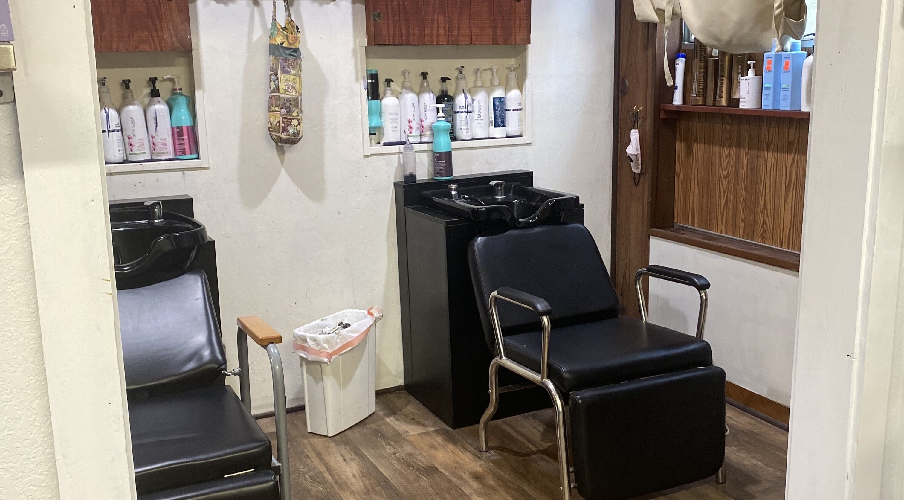 Cozy shampoo stations at Hairitage Salon, Williston, Florida, US, ready for relaxing treatments.