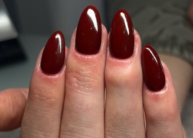 Elegant red manicured nails at LEMnails in Leeds, England, GB. Perfect for your stylish look.