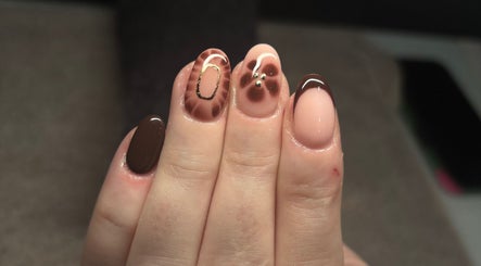 Stylish brown and nude nail art with intricate designs at LEMnails, Leeds, England, GB.