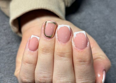 Elegant French manicure with gold trim at LEMnails, Leeds, England, GB.