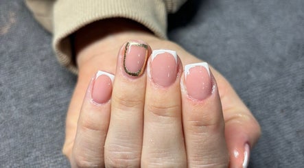 Elegant French manicure with gold trim at LEMnails, Leeds, England, GB.