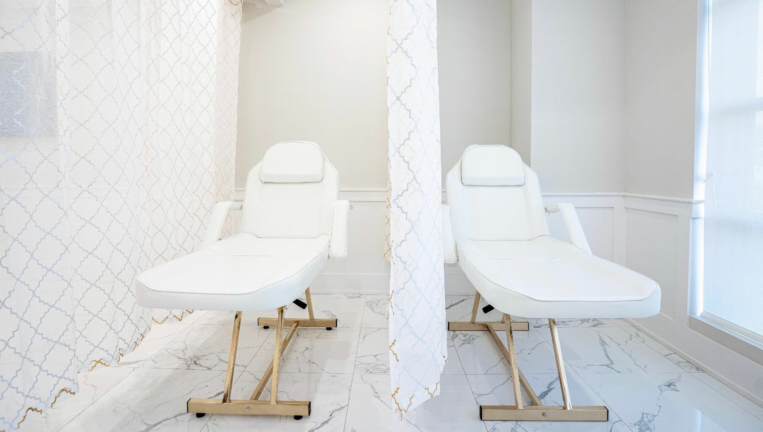 Luxurious treatment loungers at LVSH Beauty Bar in Vaughan, Ontario, CA, offering a serene spa experience.