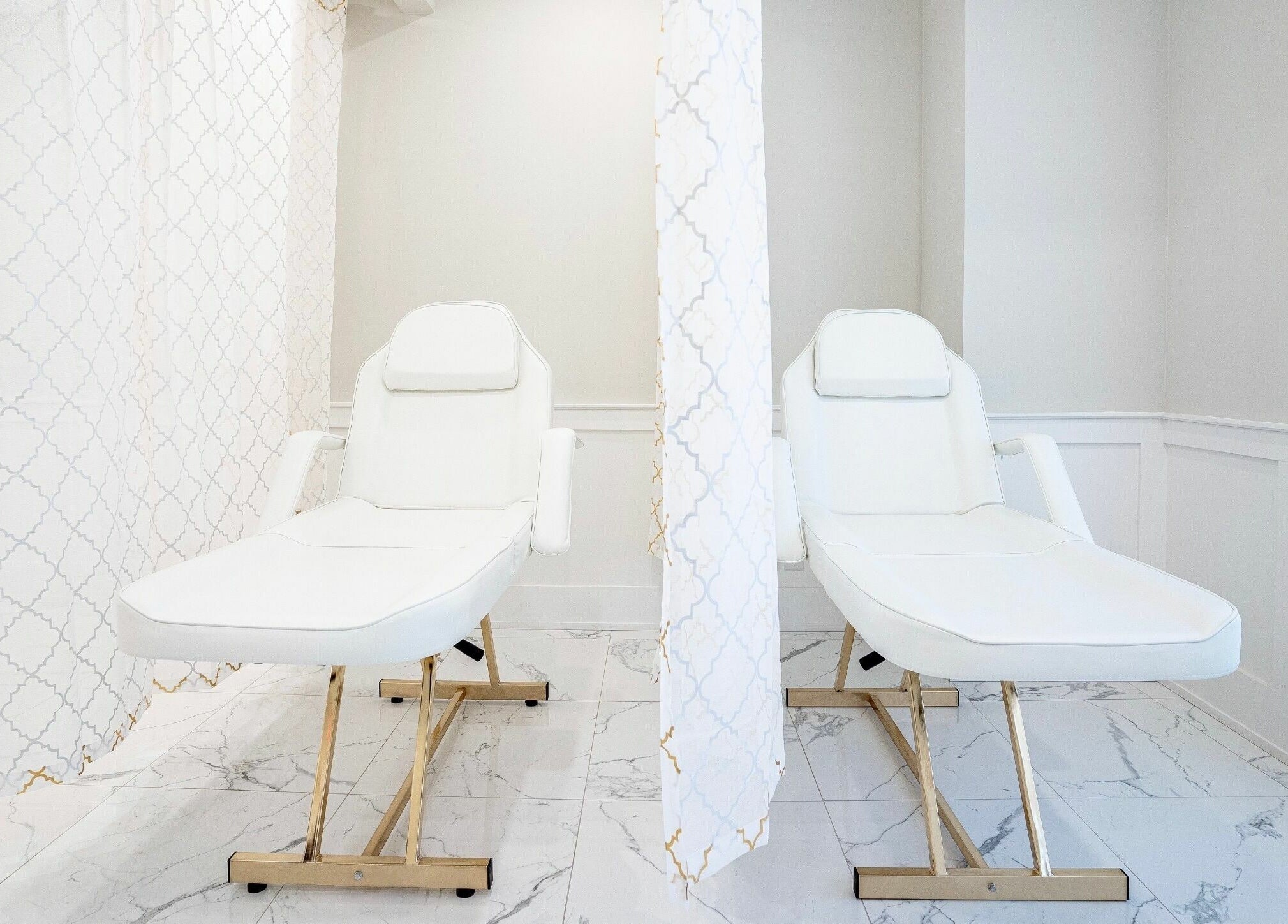 Luxurious treatment loungers at LVSH Beauty Bar in Vaughan, Ontario, CA, offering a serene spa experience.