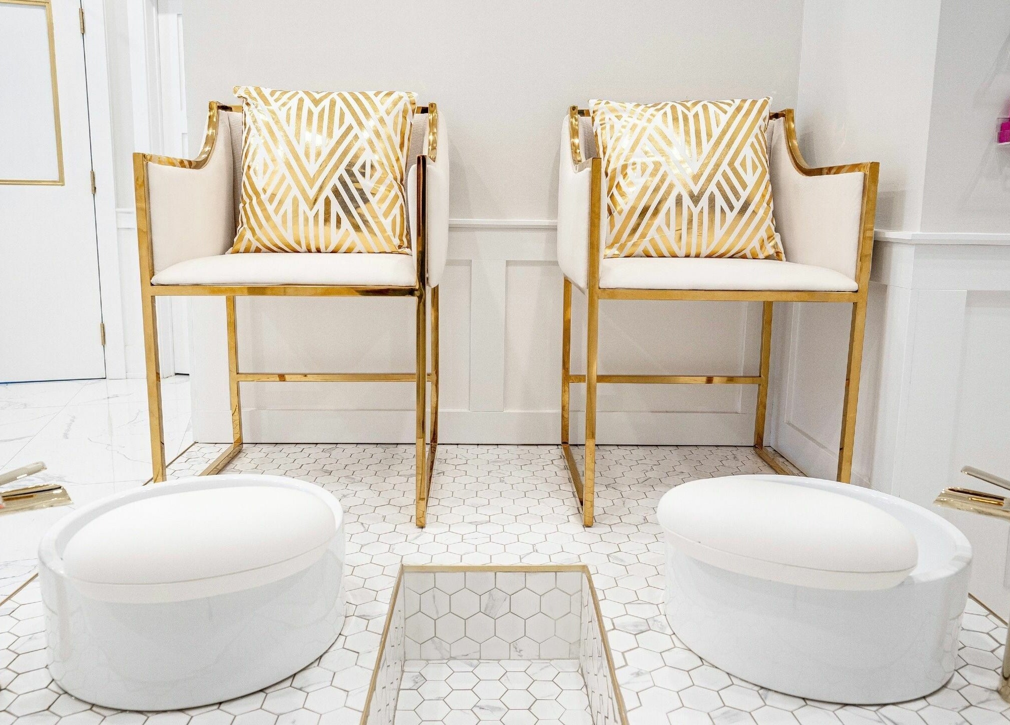 Luxurious spa chairs with gold accents at LVSH Beauty Bar in Vaughan, Ontario, CA for ultimate relaxation.