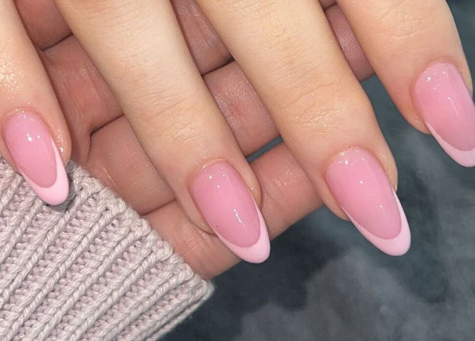 Elegant pink manicure at All Dolled Up - Leeds, Kippax, England, GB showcasing glossy nail art.