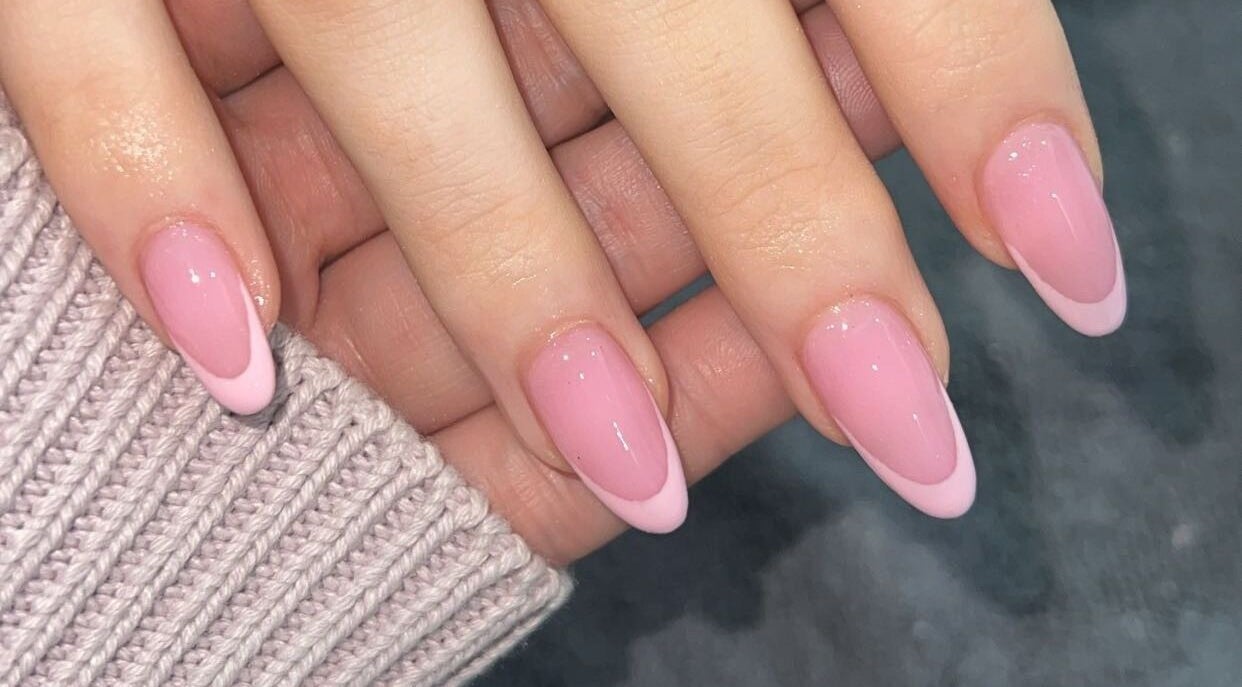 Elegant pink manicure at All Dolled Up - Leeds, Kippax, England, GB showcasing glossy nail art.