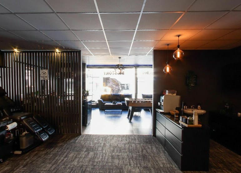 Modern salon interior at Kristiansand, Agder, NO with cozy seating and elegant lighting.