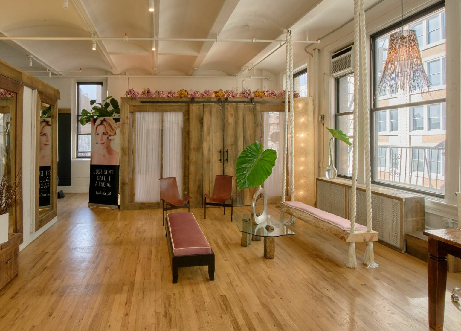 Elegant lounge area in Alchemy Space, New York, New York, US with wooden decor and natural lighting.