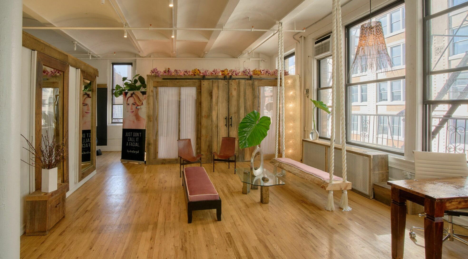 Elegant lounge area in Alchemy Space, New York, New York, US with wooden decor and natural lighting.