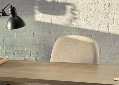 Minimalist workspace at Amethys at The Granary, Polesworth, England, featuring a desk and a modern lamp.